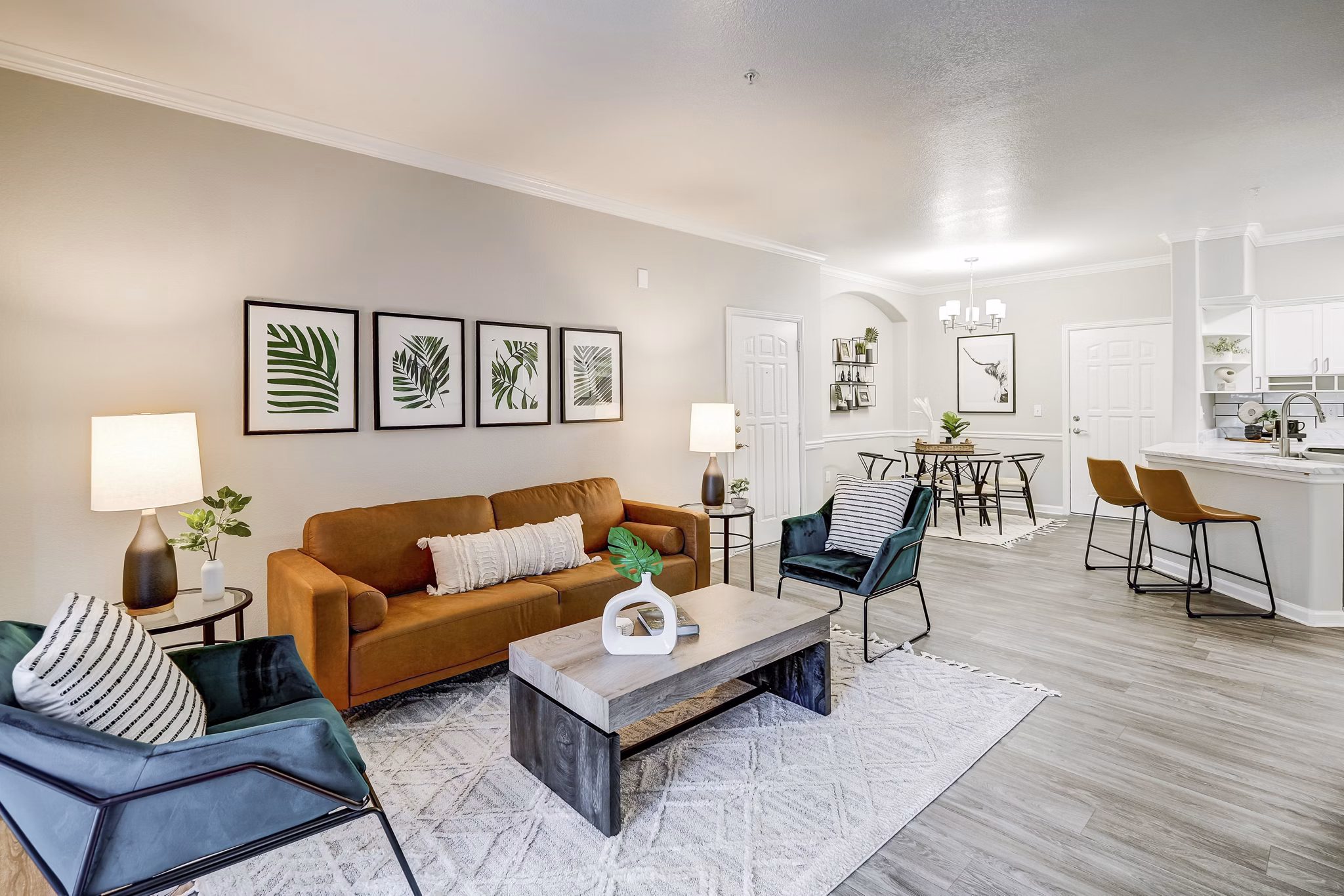 Living room with modern decor and natural light at Champions Apartments, a Greystar luxury property