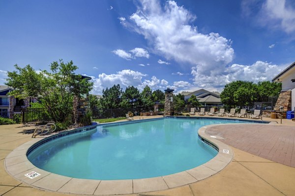 Resort-style pool at Champions Apartments, offering luxury relaxation at Greystar's premier community