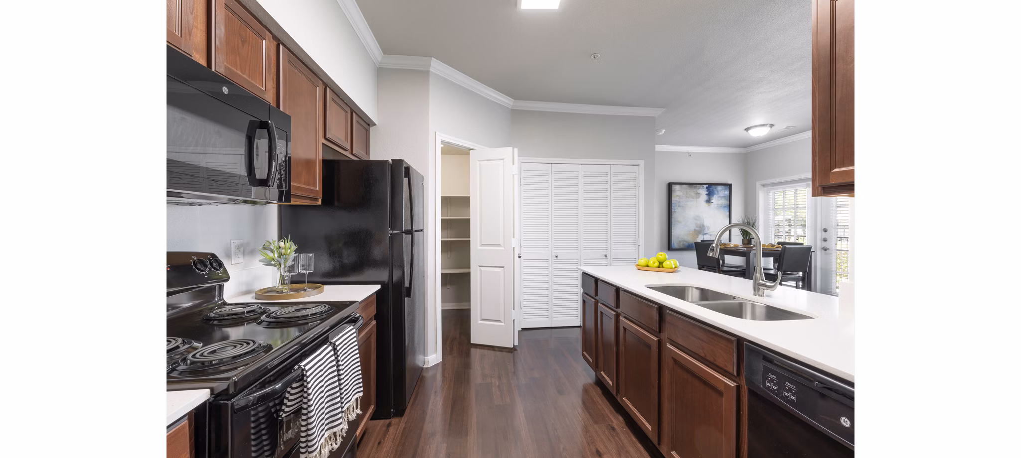 Modern kitchen with stainless steel appliances at Villages at Turtle Rock Apartments
