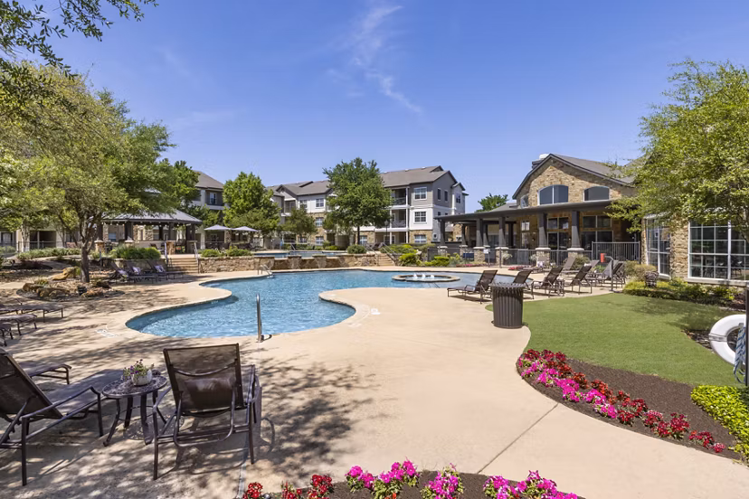 Stunning outdoor pool with lounge seating at Villages at Turtle Rock Apartments, perfect for relaxation and recreation