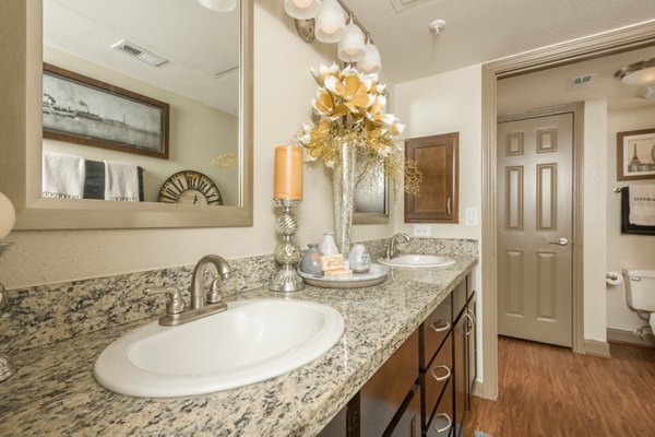 Modern bathroom with sleek fixtures at Deerwood Apartments offering comfortable luxury living
