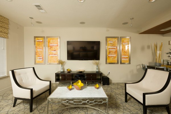 Stylish clubhouse featuring modern seating and entertainment options at Deerwood Apartments in Greystar community