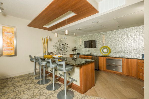 Spacious clubhouse featuring modern design and seating areas at Deerwood Apartments