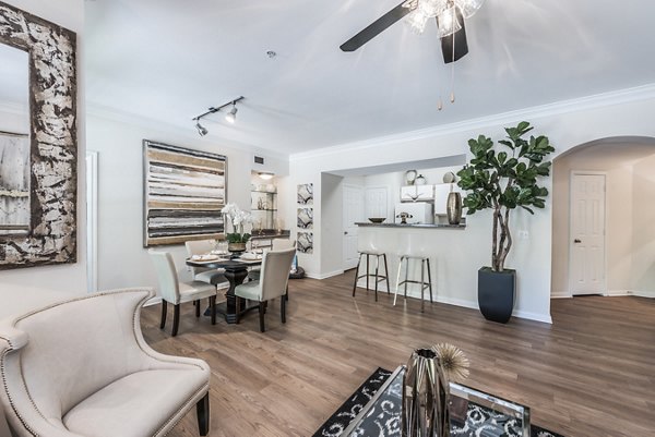 Bright living room with large windows in Reserve at Fountain Lake Apartments, offering modern amenities and stylish decor