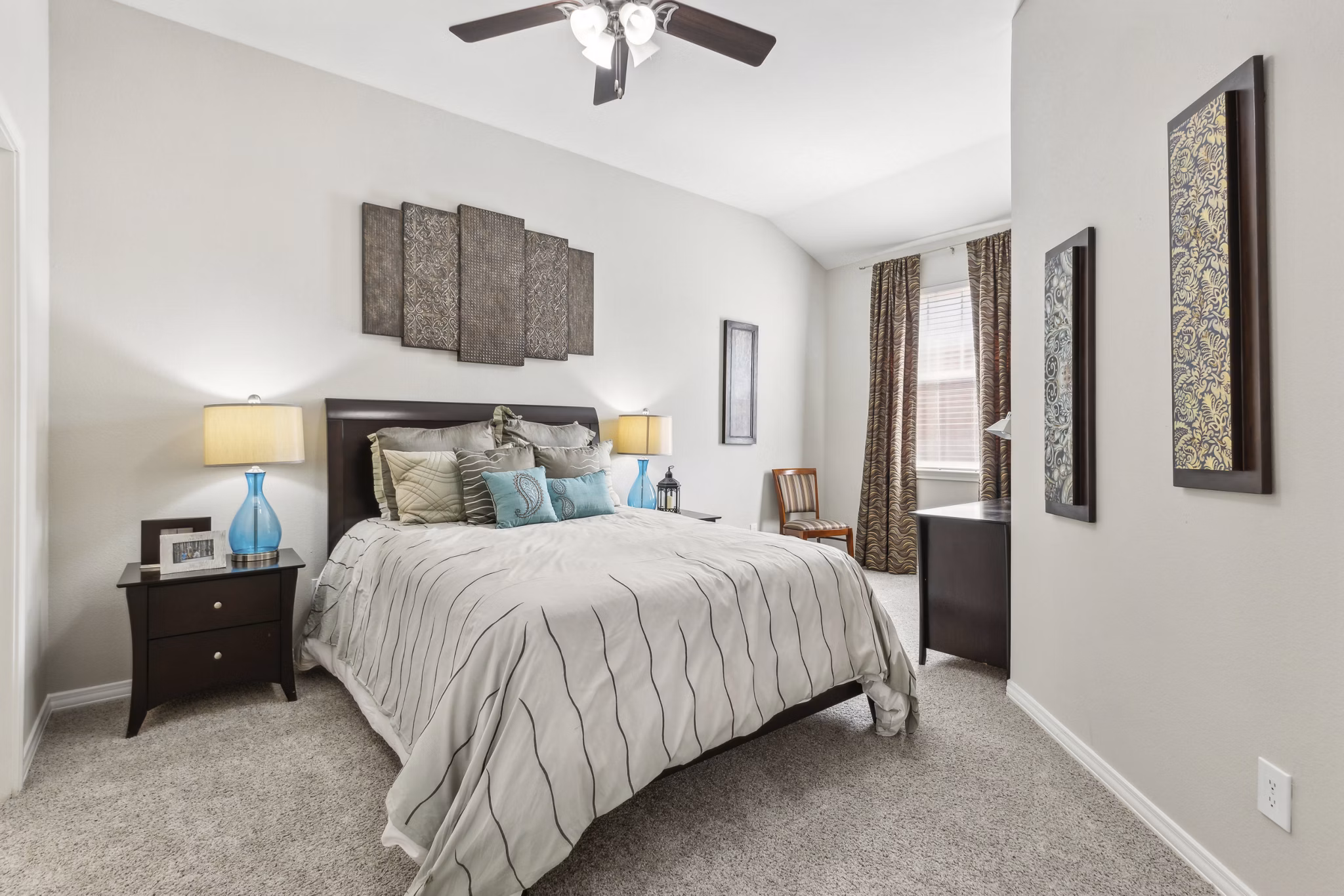Bedroom featuring cozy decor and natural light at Towns of Chapel Hill Apartments