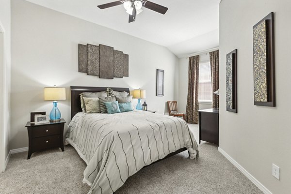 Bedroom featuring cozy decor and natural light at Towns of Chapel Hill Apartments