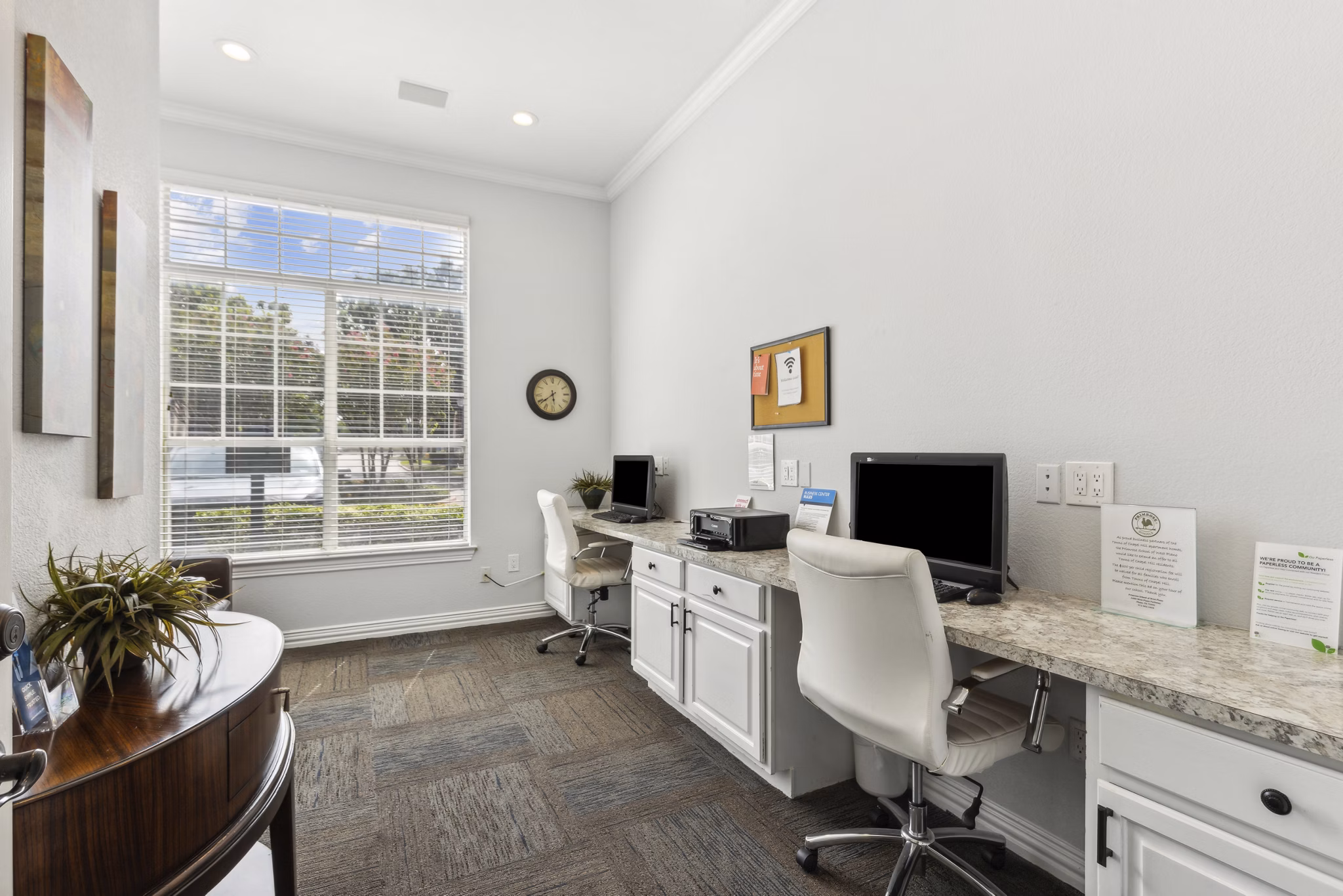 Clubhouse with modern decor and spacious seating at Towns of Chapel Hill Apartments