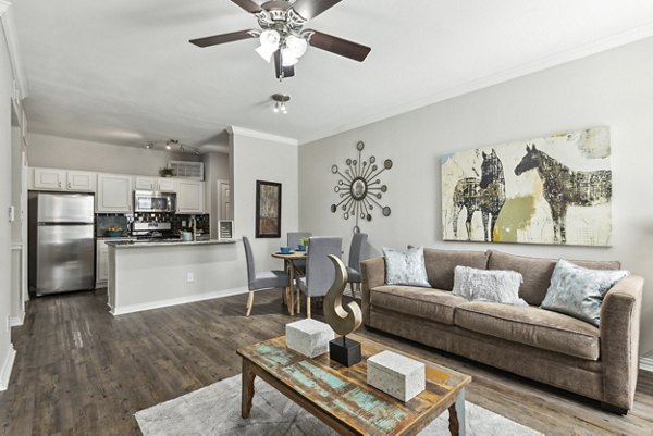 Modern clubhouse featuring elegant seating and a cozy fireplace at Towns of Chapel Hill Apartments