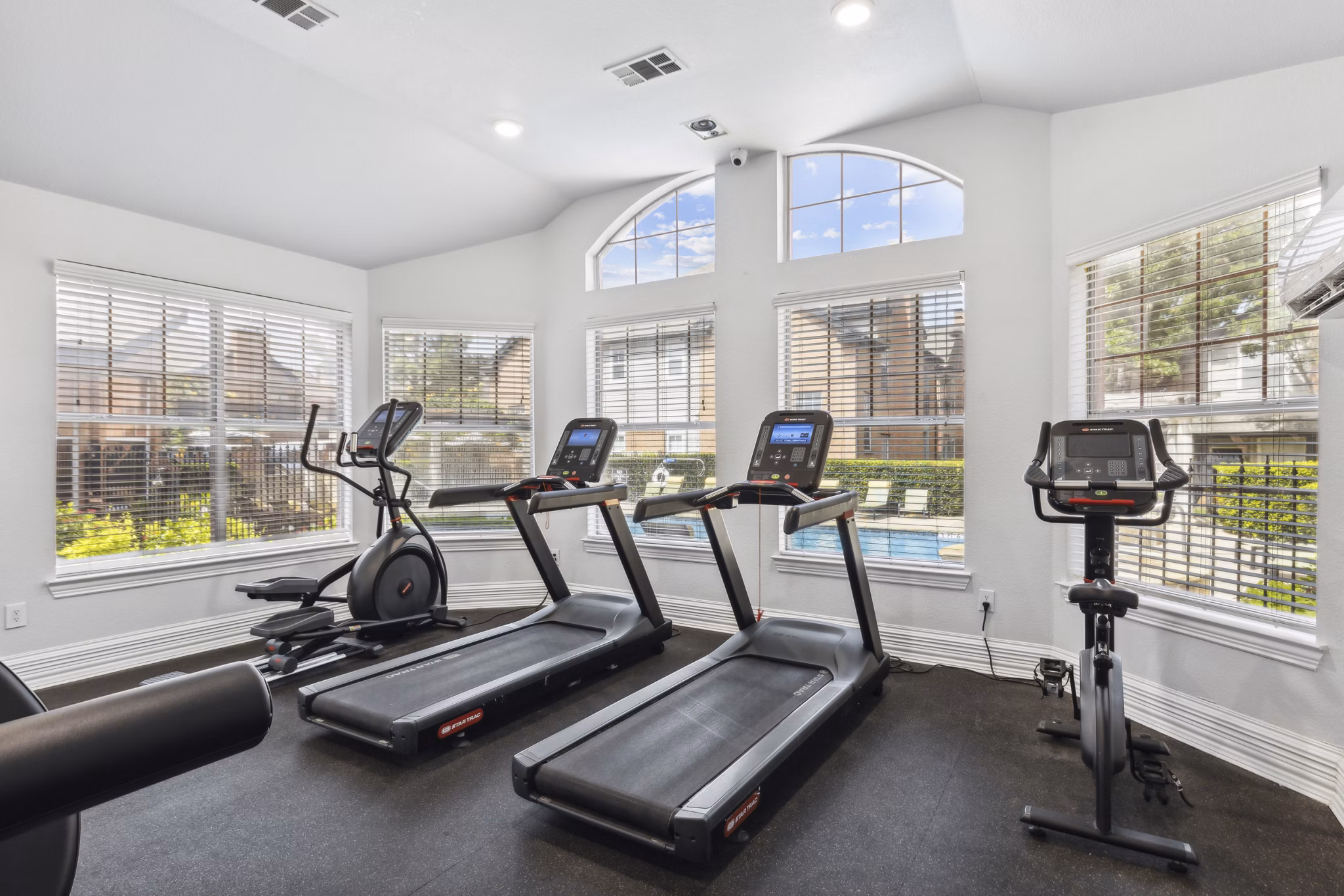 Fitness center with modern equipment at Towns of Chapel Hill Apartments