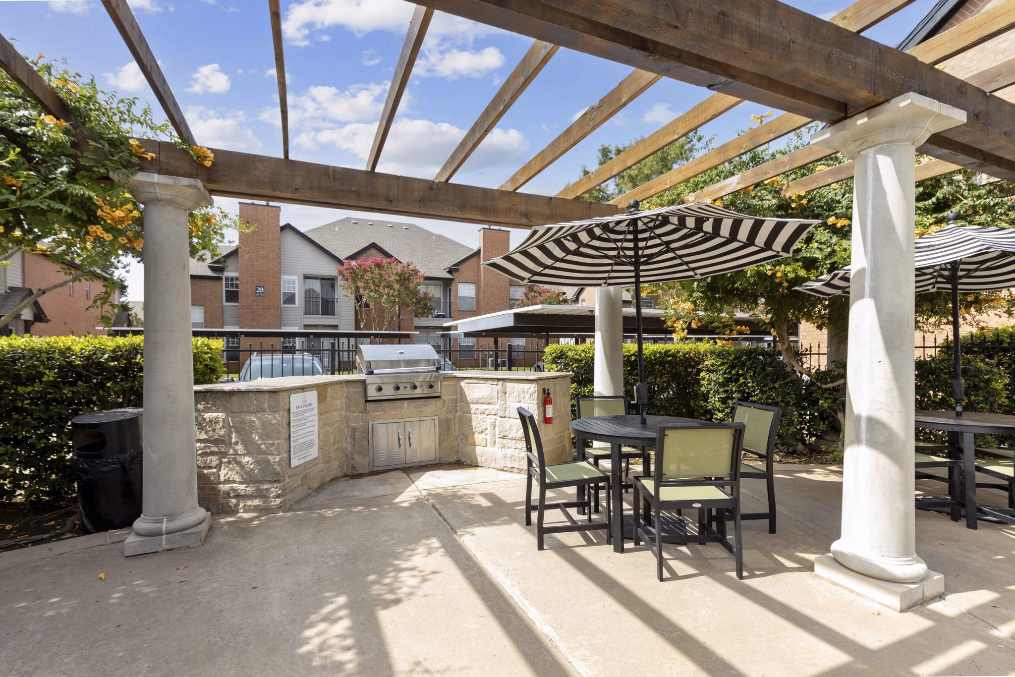 Recreational area with green spaces and seating at Towns of Chapel Hill Apartments