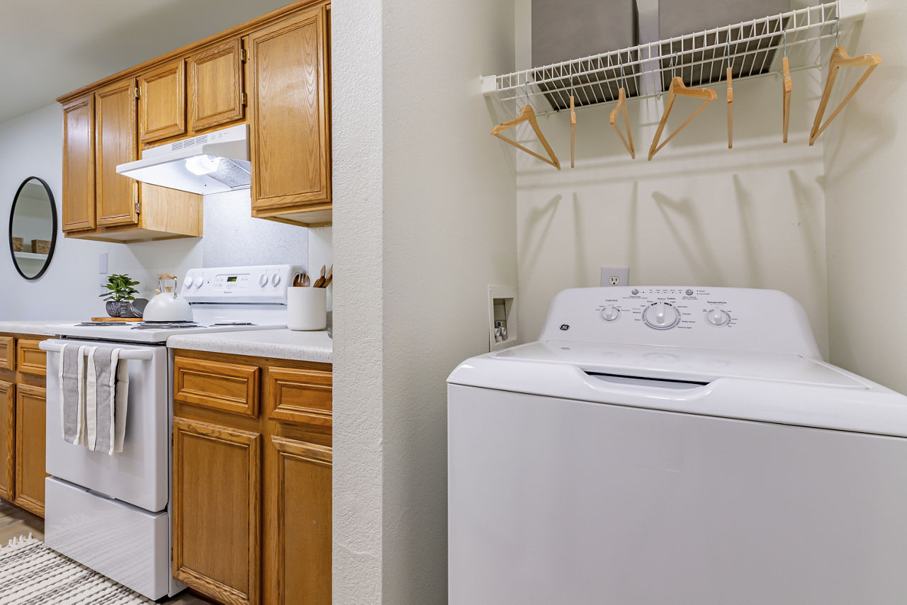 Laundry room at Tinker On Forty8 Apartments