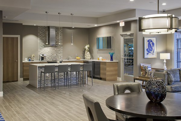 Clubhouse with modern amenities at The Village at Gracy Farms Apartments, offering luxury living spaces and community engagement opportunities