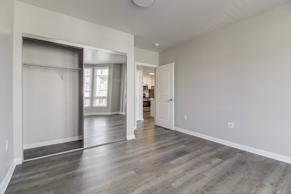Cozy bedroom with contemporary decor at Hillside Village Apartments