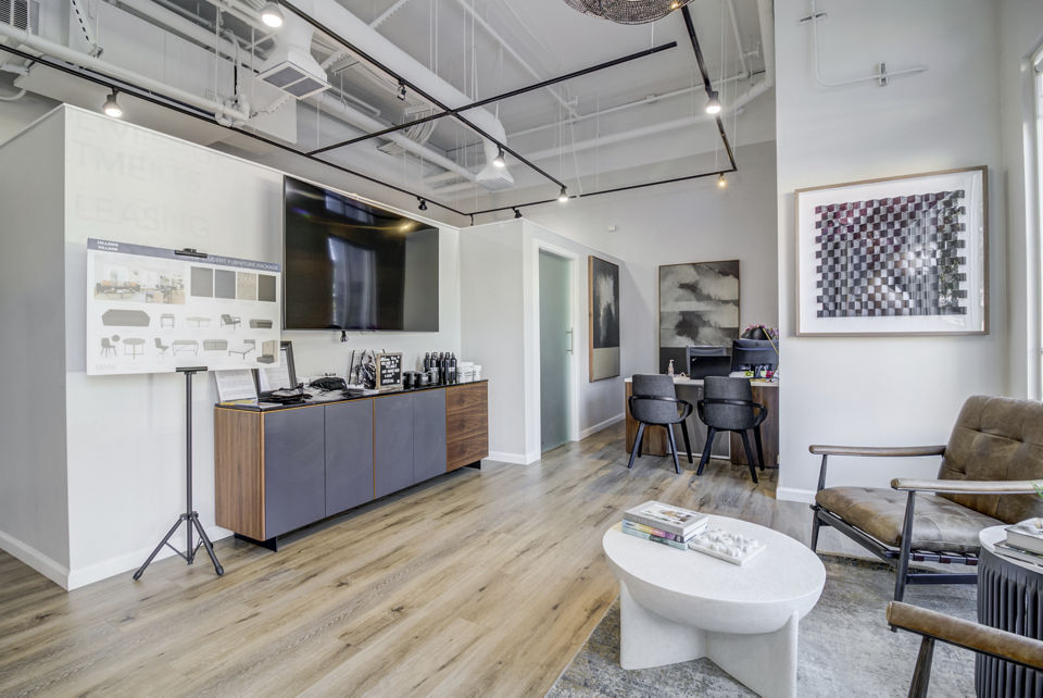 Modern clubhouse with cozy seating and fireplace at Hillside Village Apartments