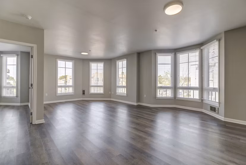Spacious living room with contemporary decor at Hillside Village Apartments, ideal for comfort and luxury living