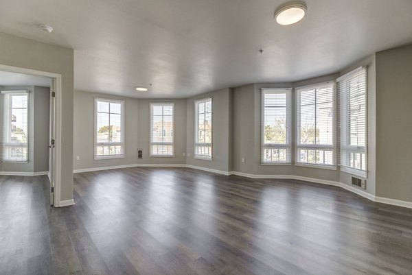 Spacious living room with contemporary decor at Hillside Village Apartments, ideal for comfort and luxury living