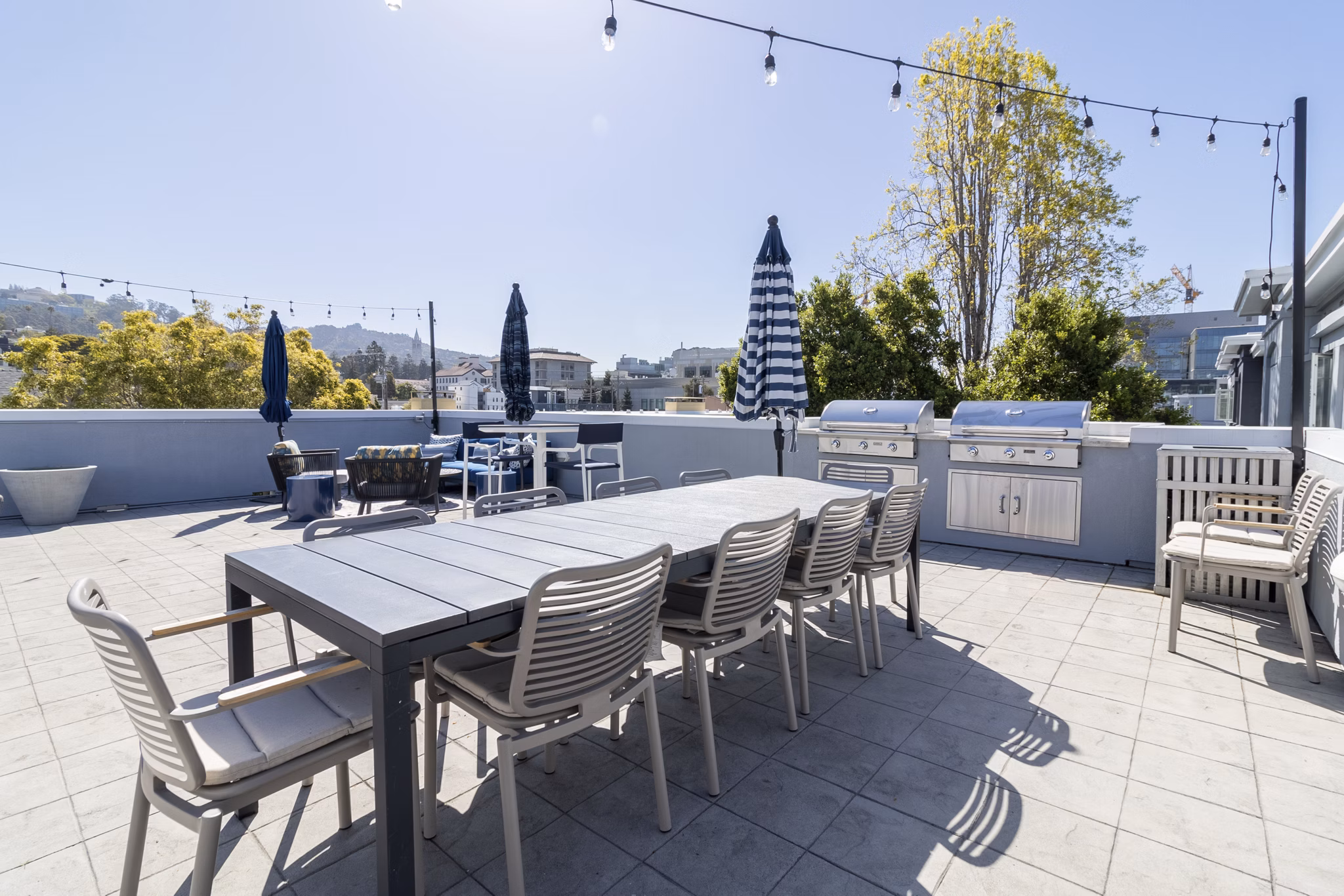 Hillside Village Apartments: Outdoor grill area featuring modern amenities and seating, perfect for social gatherings