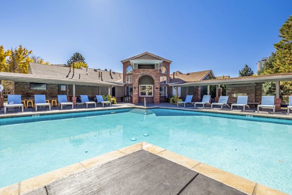 Resort-style pool with sun loungers at Waterford Cherry Creek Apartments, a luxury Greystar property in Denver