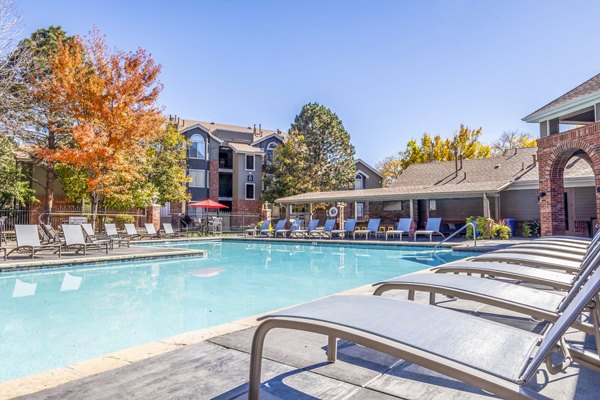 Pool with elegant landscaping at Waterford Cherry Creek Apartments, offering luxury amenities and serene outdoor spaces