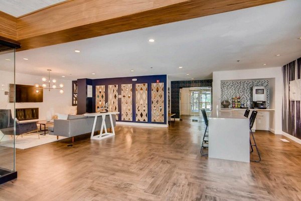 Clubhouse featuring modern lounge spaces and entertainment areas at The View on 26th Apartments, a Greystar luxury community
