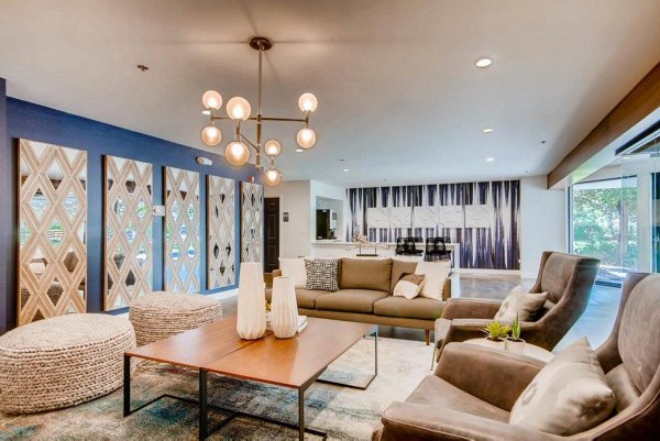Elegant clubhouse with modern design at The View on 26th Apartments, featuring a large seating area and contemporary finishes