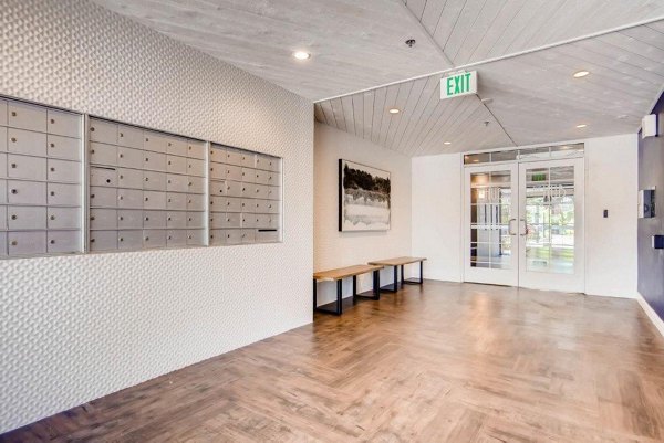 Modern mailroom with secure parcel lockers at The View on 26th Apartments