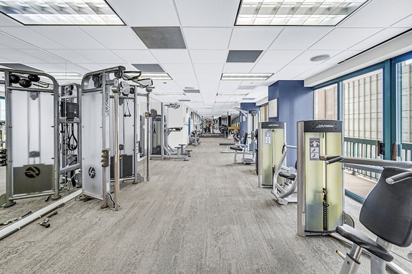 State-of-the-art fitness center with modern equipment at One Superior Place Apartments