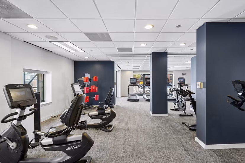 fitness center at One Superior Place Apartments