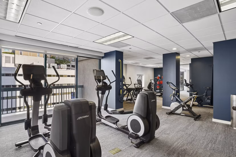 fitness center at One Superior Place Apartments