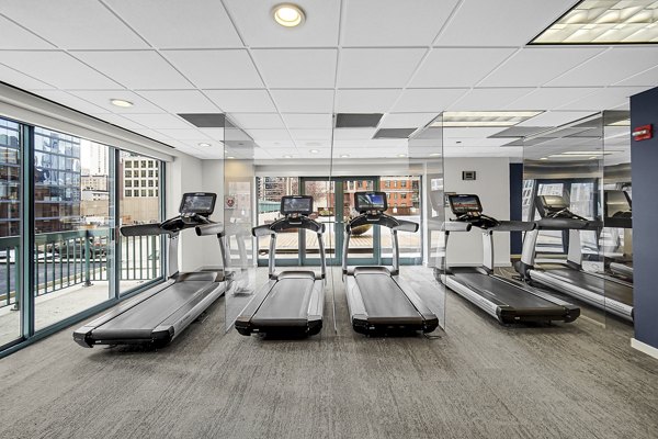 fitness center at One Superior Place Apartments