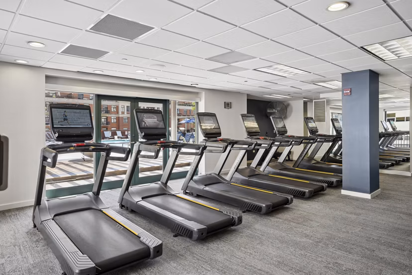 fitness center at One Superior Place Apartments