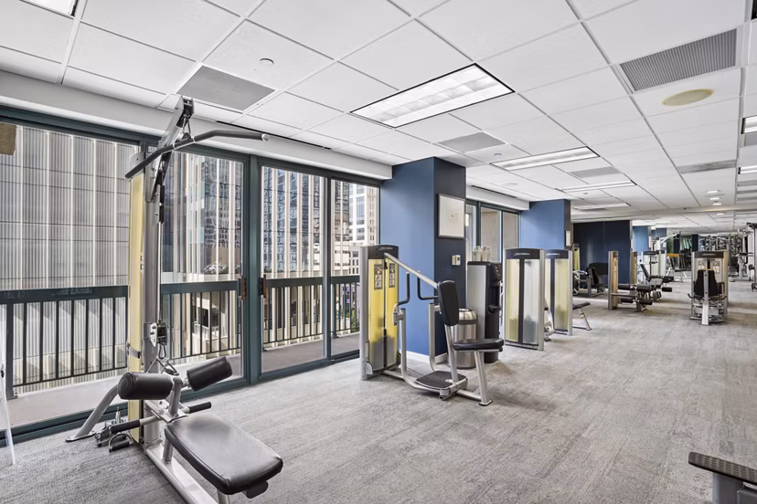 fitness center at One Superior Place Apartments