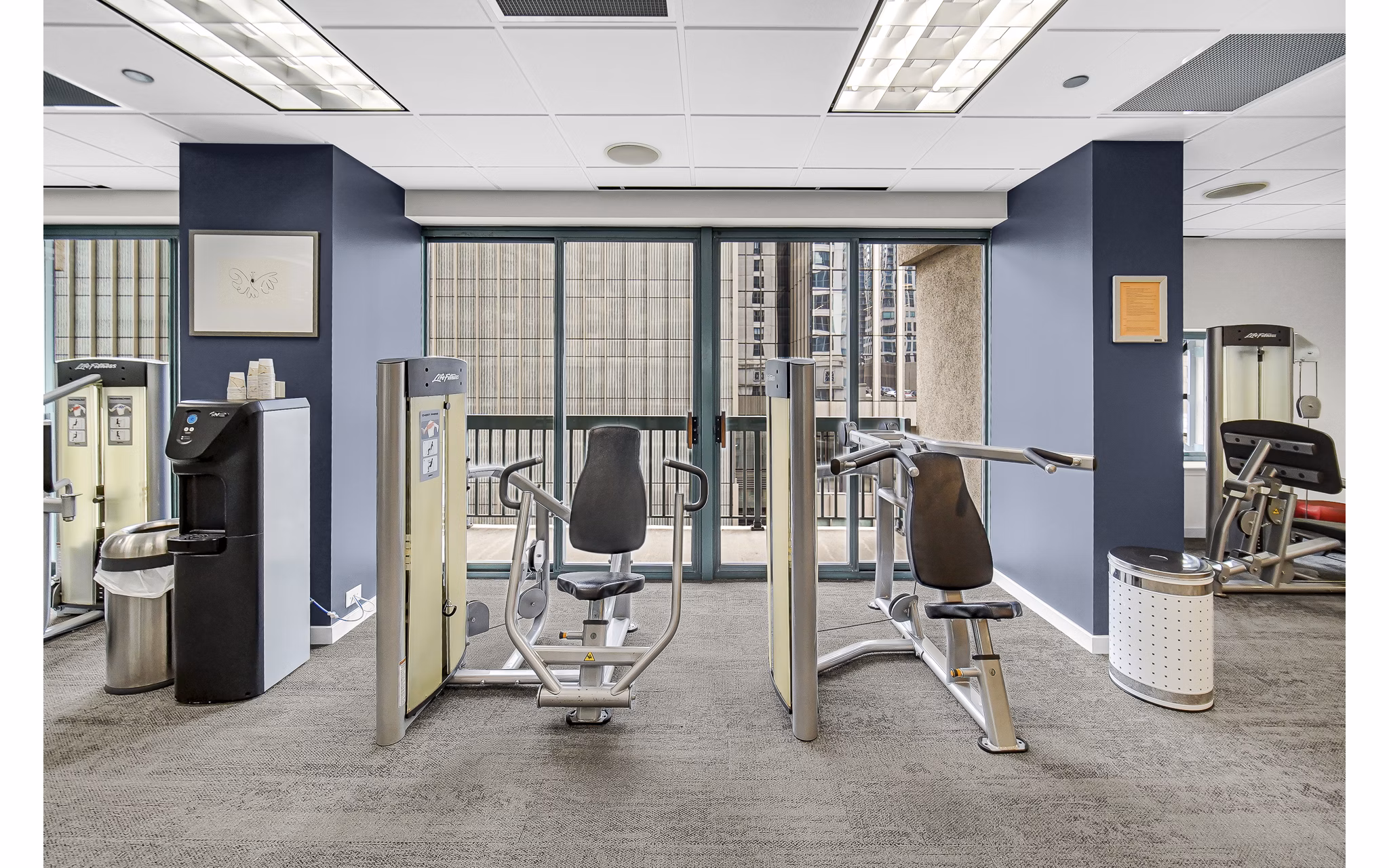 fitness center at One Superior Place Apartments