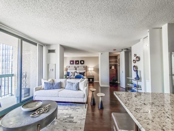 Modern living room with sleek furnishings in One Superior Place Apartments, Chicago