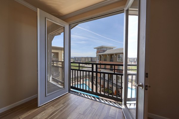 Cielo Apartments: Private balcony with city views at luxury apartments in an urban setting