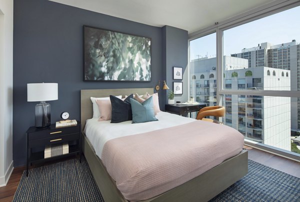 Cozy bedroom with a plush king bed and modern decor at 1225 Old Town Apartments