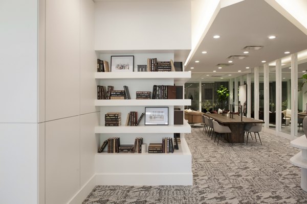 Clubhouse featuring modern design and communal seating at 1225 Old Town Apartments
