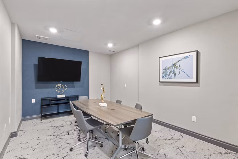 Professional meeting facility with modern seating and conference technology at Vue 21 Apartments