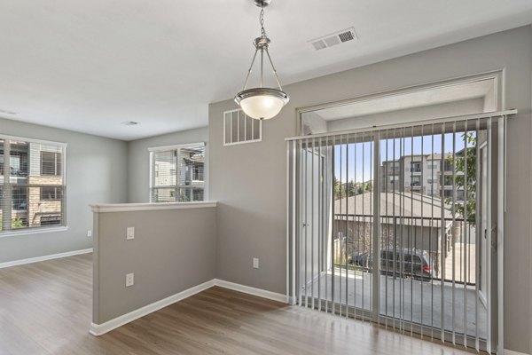 Chic dining area with modern furnishings in Vue 21 Apartments