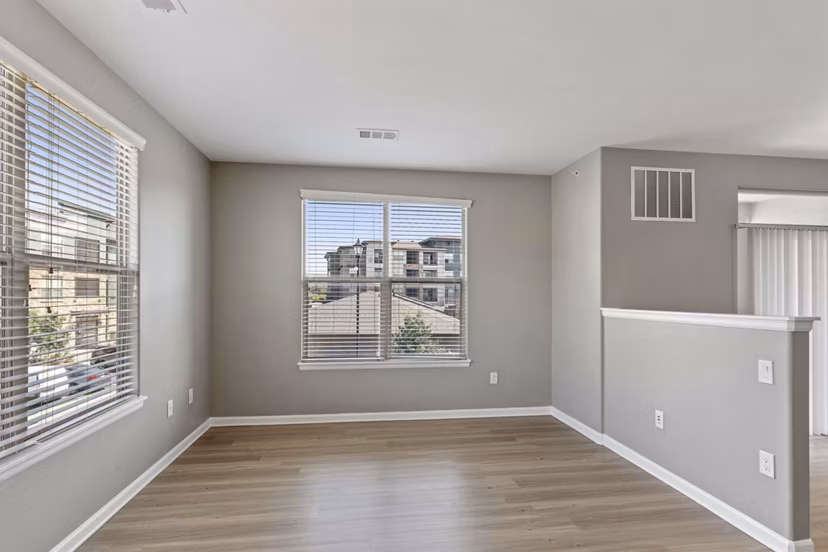Dining area with stylish seating and modern lighting in Vue 21 Apartments