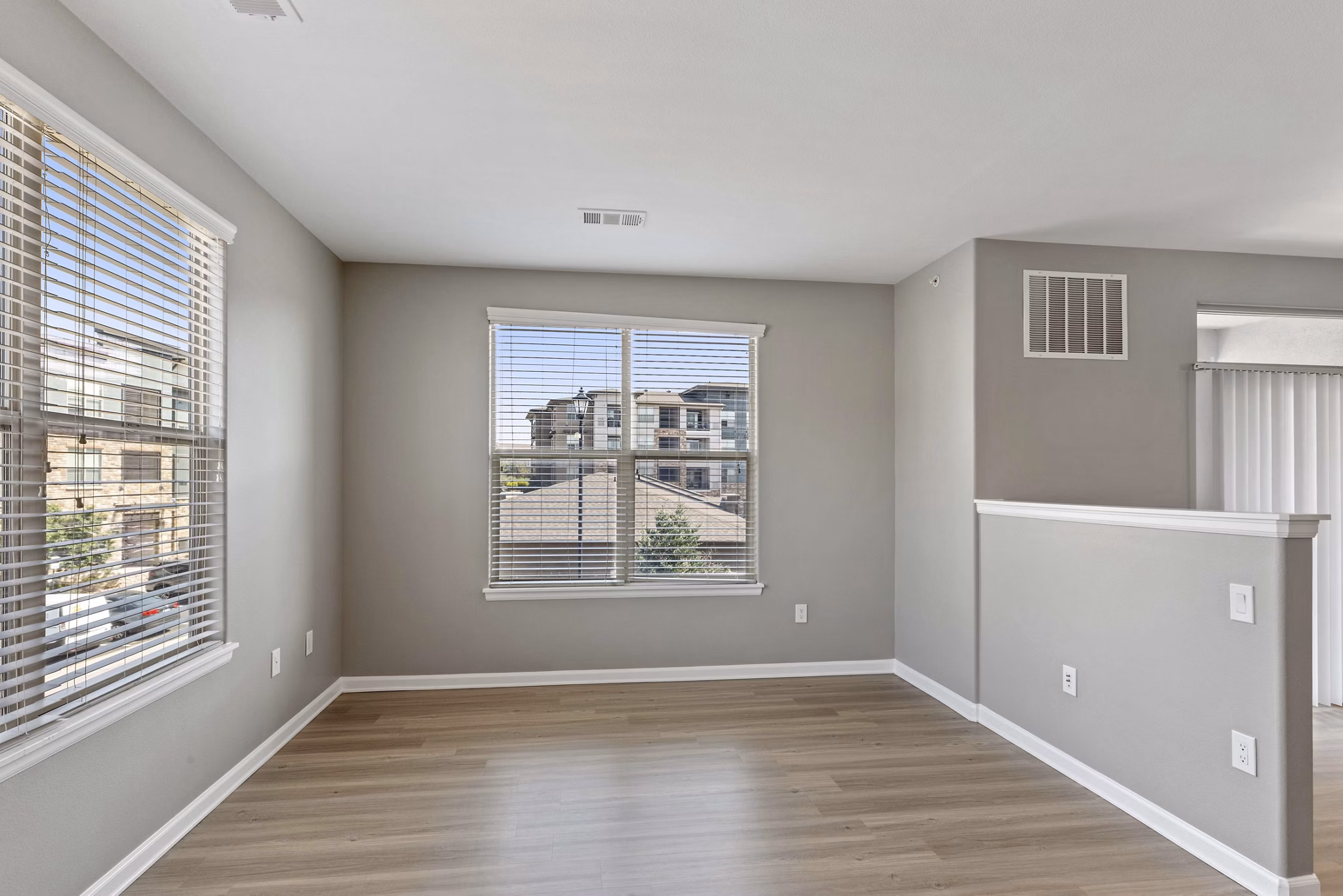 Dining area with stylish seating and modern lighting in Vue 21 Apartments