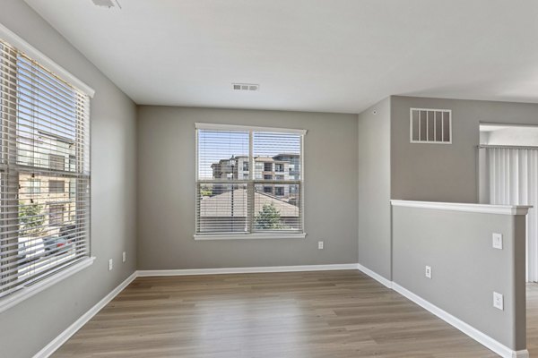 Dining area with stylish seating and modern lighting in Vue 21 Apartments