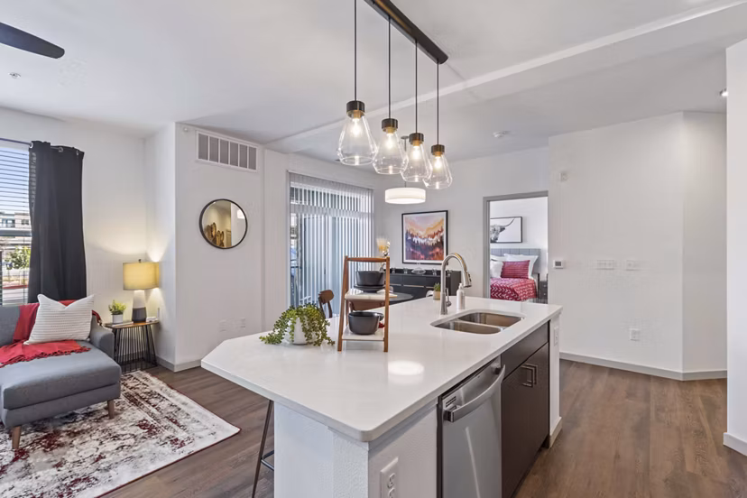 Modern kitchen with stainless steel appliances at Vue 21 Apartments, an upscale living option in Colorado Springs