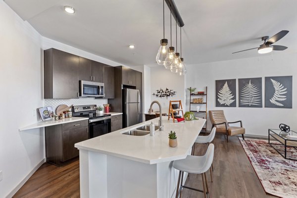 Modern kitchen with sleek countertops and stainless steel appliances in Vue 21 Apartments, luxury living in Colorado Springs