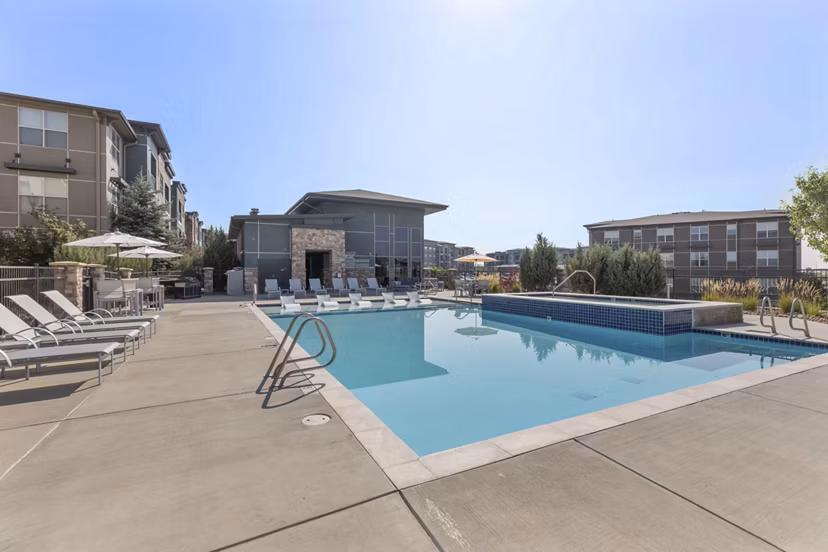 Resort-style pool with shaded lounge areas at Vue 21 Apartments, ideal for relaxation and socializing