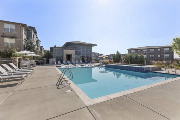 Resort-style pool with shaded lounge areas at Vue 21 Apartments, ideal for relaxation and socializing