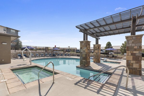 Relaxing poolside at Vue 21 Apartments featuring modern amenities and scenic views