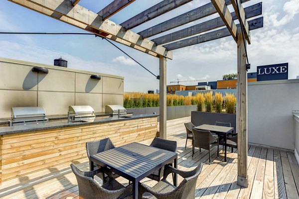 grill area at Luxe on Madison Apartments Rooftop Deck