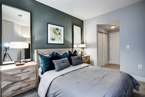 Cozy bedroom with modern design elements at Del Ray Central Apartments