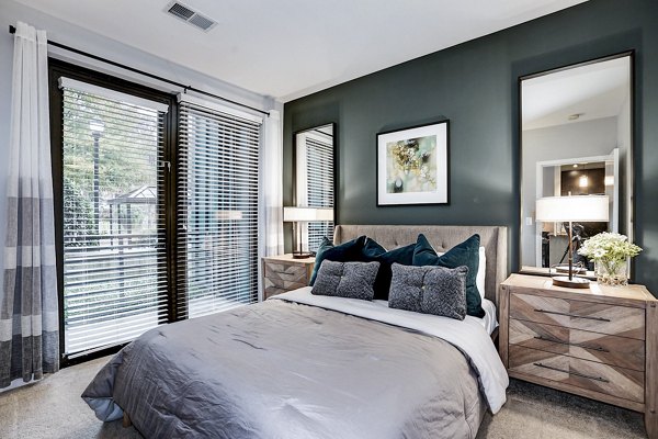 Cozy bedroom with modern furnishings in Del Ray Central Apartments